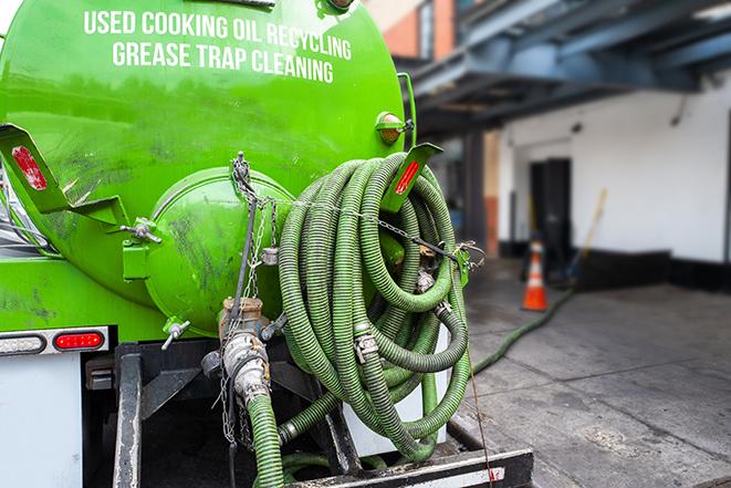 heavy-duty grease trap pumping equipment in action in Bedminster